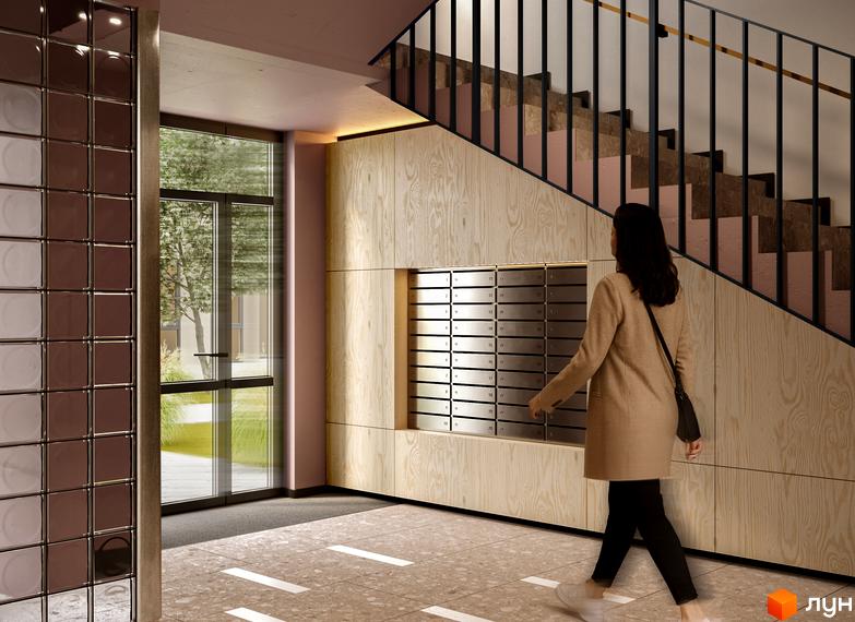 Інтер'єр вестибюля житлового комплексу SOFIhome з поштовими скриньками, сходами та видом на зелену прибудинкову територію.