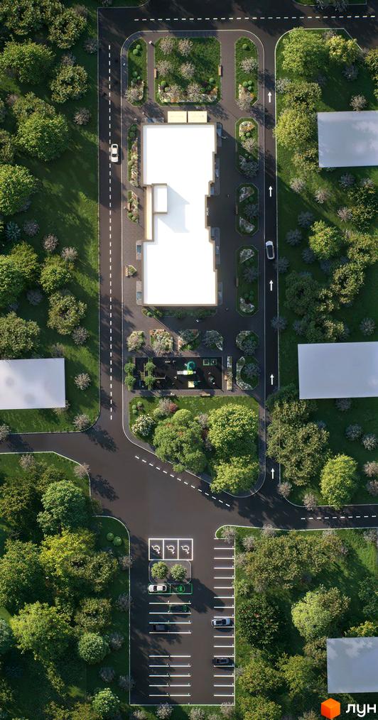 Вигляд зверху на багатоповерховий будинок Житлового комплексу Молоді. Прибудинкова територія з зеленими насадженнями, дитячим майданчиком та паркінгом.