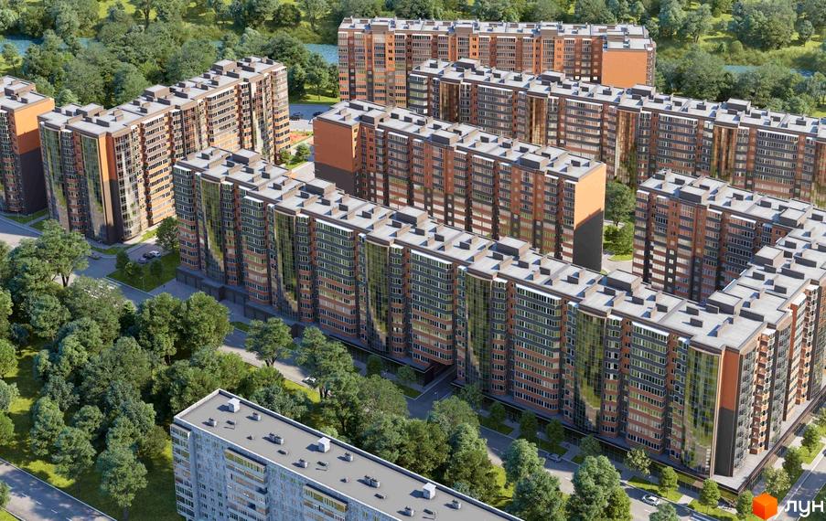 Багатоповерхові будинки River Town з цегляними та скляними фасадами розташовані серед зелені та дерев. Комплекс оточений природою біля водойми.