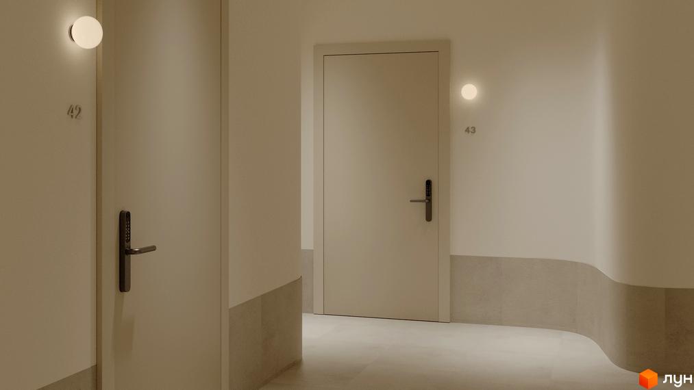 Коридор житлового комплексу З.40 з двома дверима, освітленими настінними світильниками. На дверях встановлені цифрові замки.