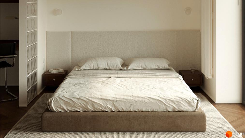 Спальня в житловому комплексі З.40 з великим ліжком, приліжковими тумбами та світлим текстилем. Інтер'єр доповнений перегородкою зі склоблоків.