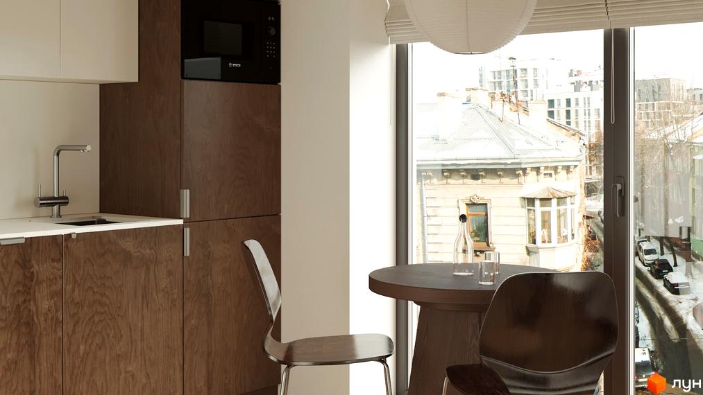 Вид з вікна З.40 на міський пейзаж з історичними будівлями та новими забудовами. На вулиці видно автомобілі та сніг.