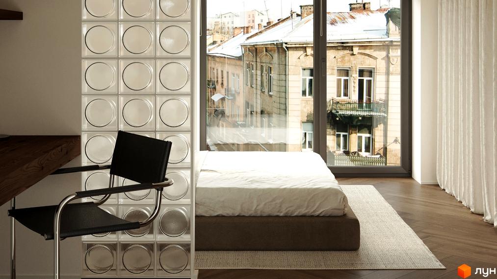 Вид з вікна квартири З.40 на історичну забудову міста. За вікном видно багатоповерхові будинки з балконами та засніжені дахи.