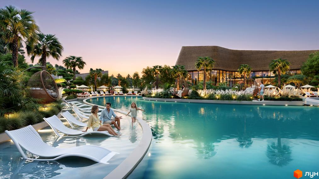 Будівля Апарт-готель ONOKY River Club з вигнутим дахом та панорамними вікнами. Навколо великий басейн з лежаками, пальми та зелені насадження.