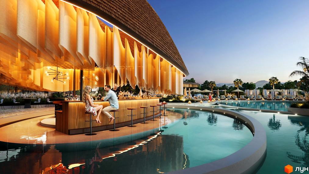 Апарт-готель ONOKY River Club з вигнутим дахом та підсвіченим інтер'єром. Поруч великий басейн з лаунж-зонами та пальмами.