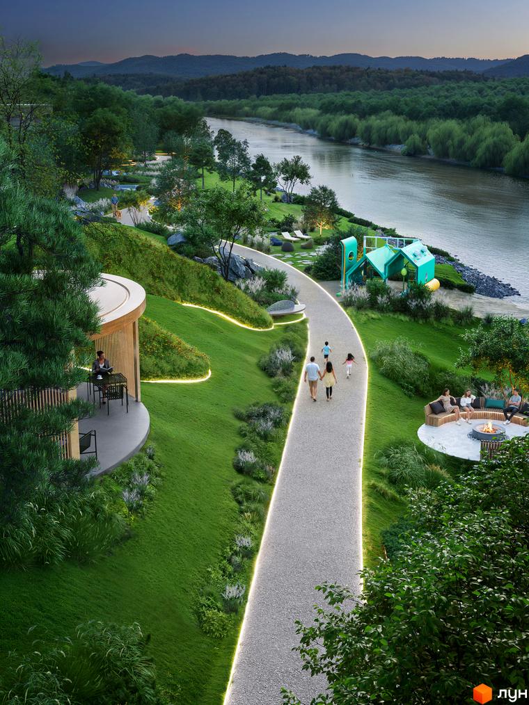 Апарт-готель ONOKY River Club з округлою терасою та дерев'яним фасадом, розташований біля річки серед доглянутого зеленого ландшафту з підсвіченими доріжками.