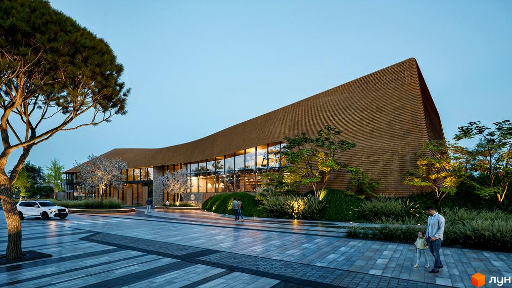 Апарт-готель ONOKY River Club з коричневим фасадом та великими вікнами, освітленою прибудинковою територією з деревами та доріжками.