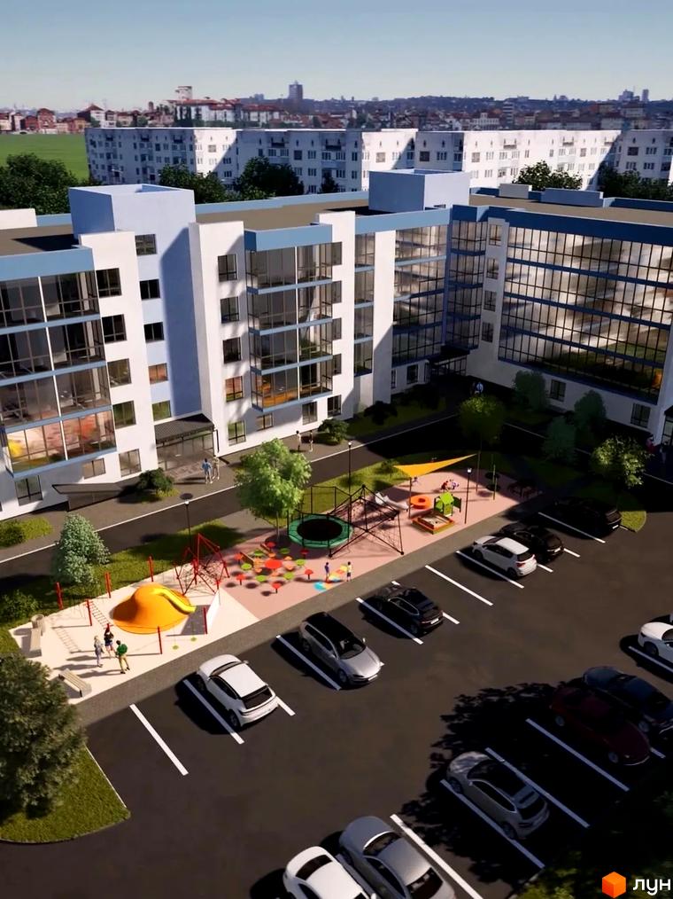 Житловий комплекс Волошкові озера з фасадами білого та блакитного кольору, паркінгом та дитячим майданчиком. Зовнішній вигляд новобудови та прибудинкової території.