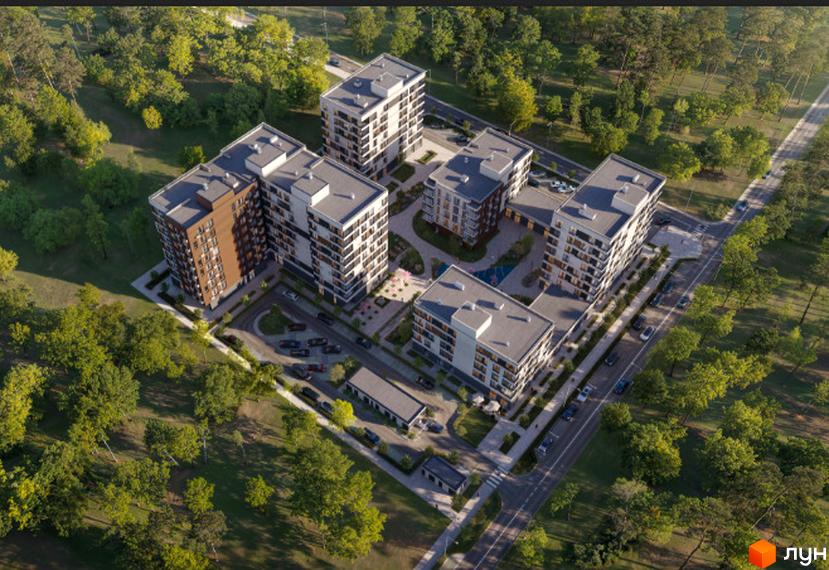 Житловий комплекс RE-FORMAT ALPHA: аерофотографія багатоповерхових будинків зі світлими та коричневими фасадами, оточених зеленим лісом, з внутрішнім двором та парковками.