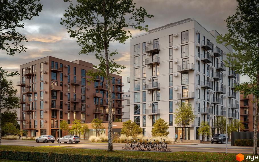 Зовнішній вигляд новобудови ЖК Aqua Vita з коричневими та білими фасадами, балконами та кондиціонерами. Прибудинкова територія з деревами, велосипедами та автомобілями.