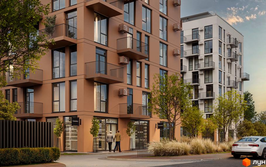 Житловий комплекс Aqua Vita з коричневим фасадом та білою новобудовою поруч. Прибудинкова територія з деревами та травою.