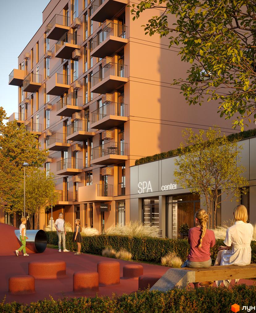 Зовнішній вигляд будинку ЖК Aqua Vita з балконами та фасадом кольору персика, поруч дитячий майданчик та зелена зона відпочинку.