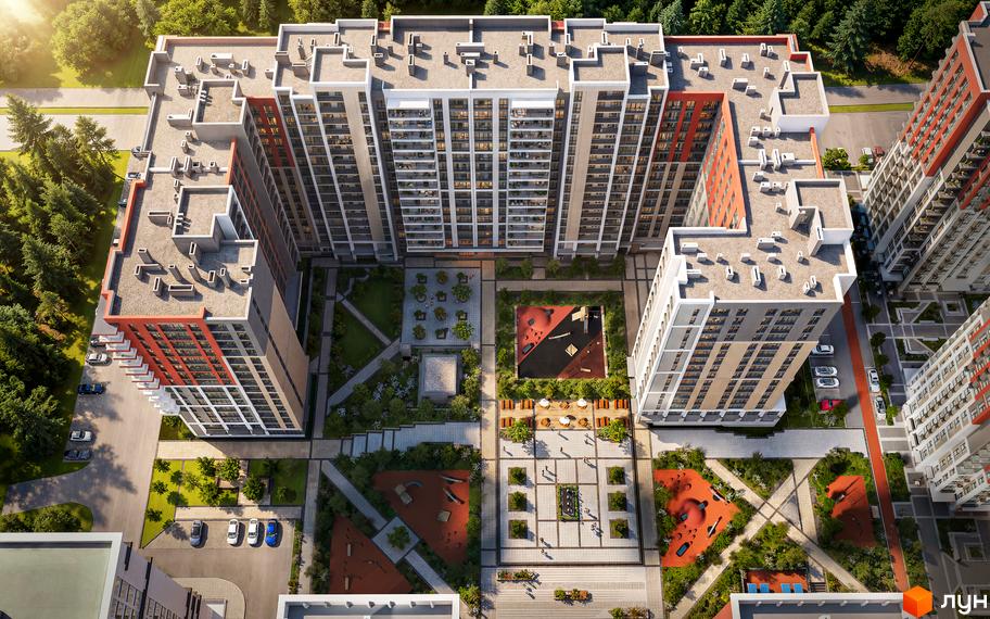 Вид зверху на житловий комплекс Irpin City з багатоповерховими будинками та облаштованою прибудинковою територією з дитячими майданчиками та зонами відпочинку.