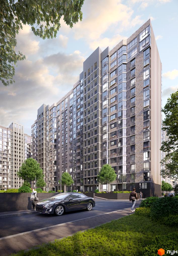 Житловий комплекс Прохоровський квартал: фасади будівель з цегляним оздобленням та великою кількістю вікон, прибудинкова територія з деревами та автомобілем.