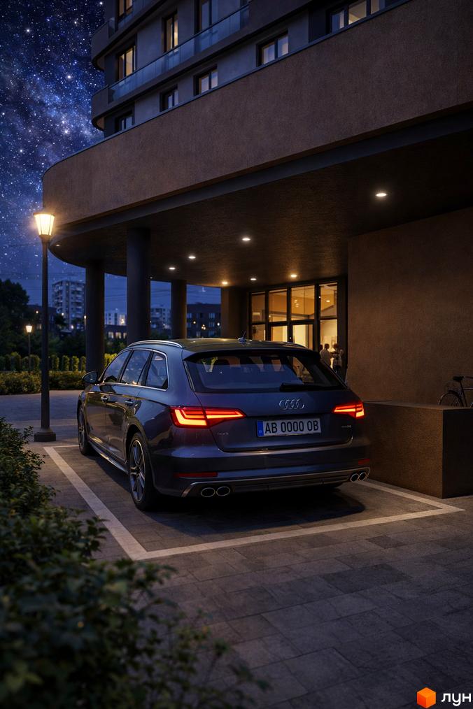 Житловий комплекс Protezione з темним фасадом та підсвіченими вікнами вночі. Парковка біля будинку з автомобілем Audi.