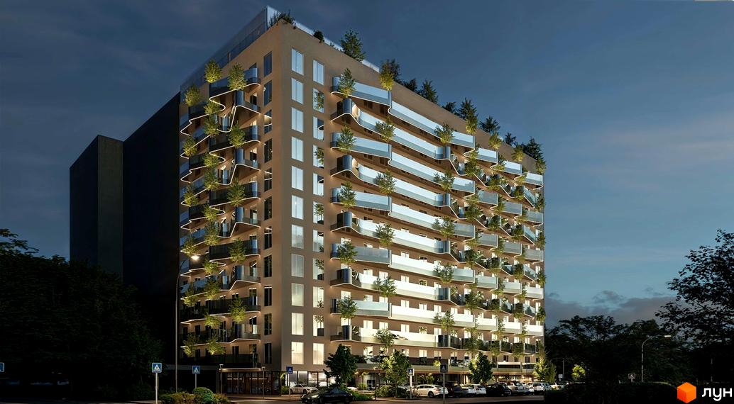 Житловий комплекс Володимирський з балконами, озелененими деревами, та освітленням вночі. Навколо будинку розташовані дерева та припарковані автомобілі.