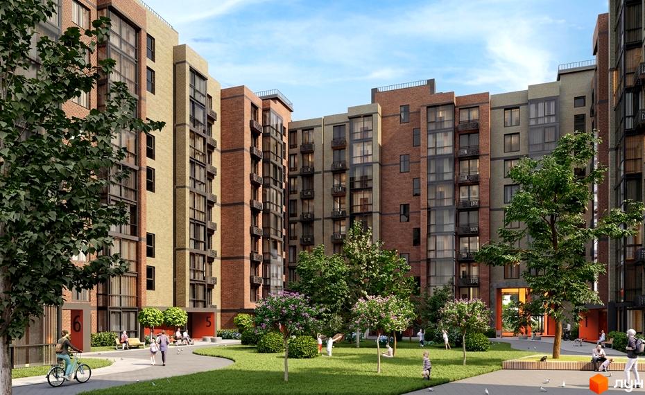 Житловий комплекс Vodogray UN1T з цегляними фасадами та затишним внутрішнім двориком з деревами та місцями для відпочинку.