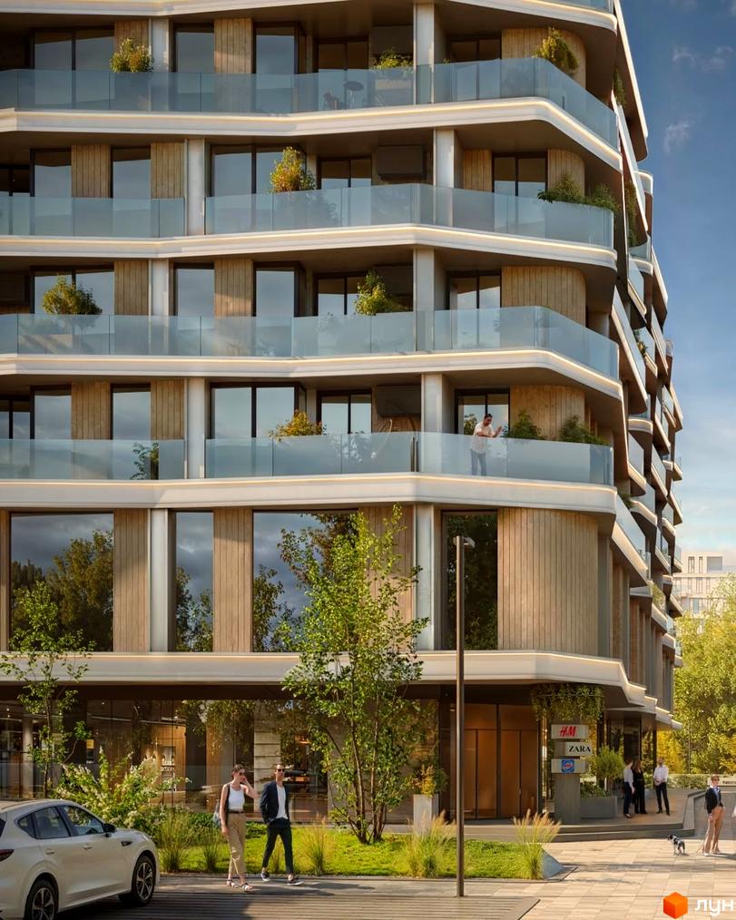 Новобудова на вул. Трускавецька, 17а, з балконами та скляними огорожами. На прибудинковій території дерева та пішохідна зона.