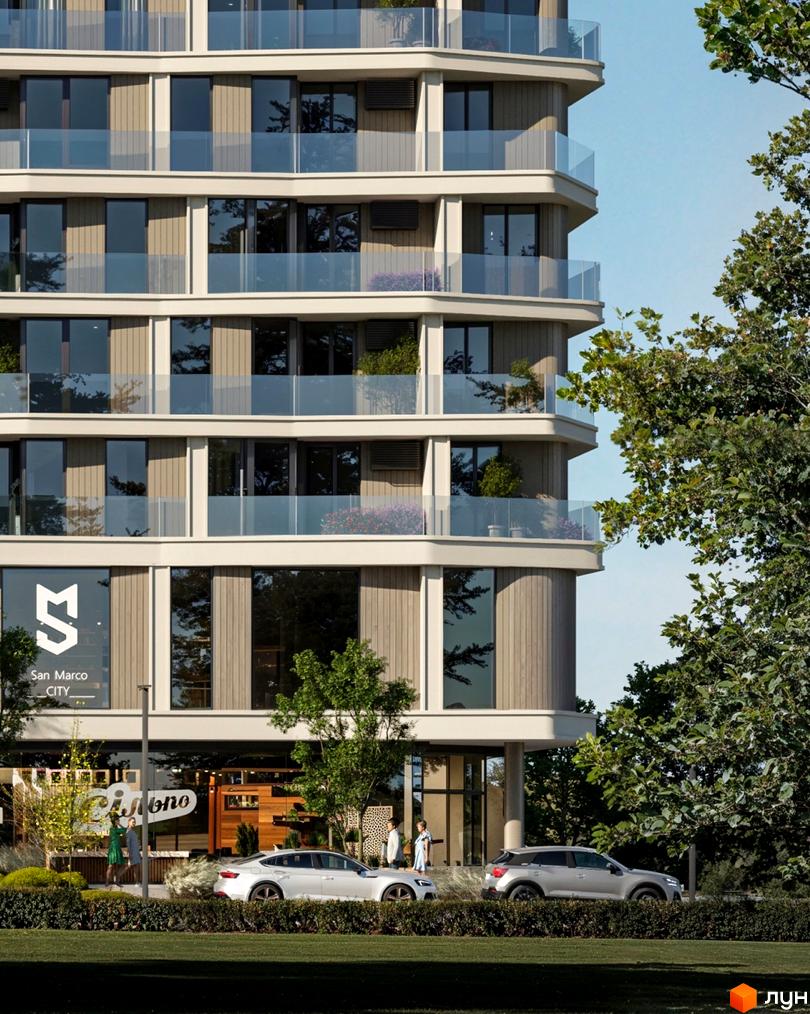 Зовнішній вигляд новобудови San Marco CITY з балконами та скляними огорожами. Прибудинкова територія з деревами та автомобілями.