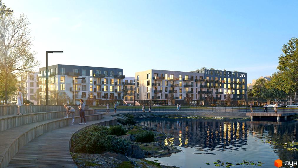 Новобудова ЖК VERO з балконами та великими вікнами, розташована біля водойми з облаштованою набережною для відпочинку та занять спортом.
