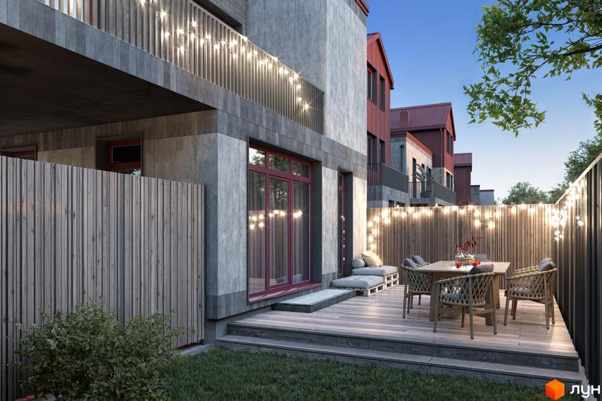 Таунхауси New Smart 14 з дерев'яним парканом, терасою та вуличними гірляндами. Зовнішній вигляд будинків з червоними дахами та сірими фасадами.