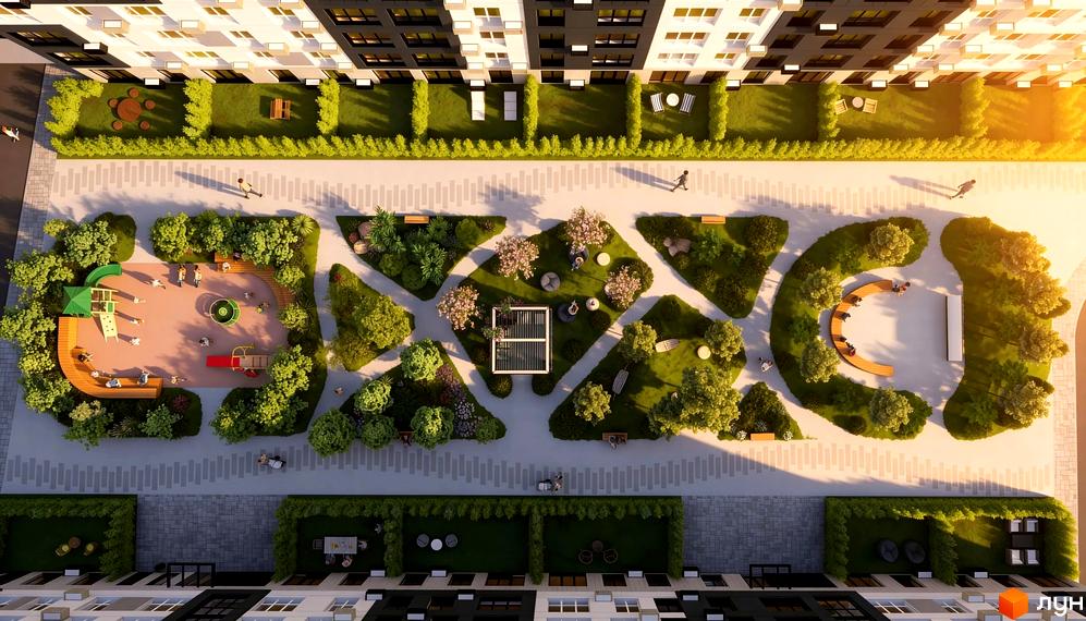 Житловий комплекс KLEN: вид зверху на будівлі та зелену прибудинкову територію з дитячим майданчиком та зонами відпочинку.