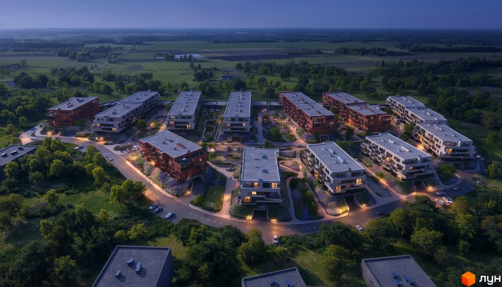 Житловий комплекс Greenville Prostir: багатоповерхові будинки з червоними та світлими фасадами, оточені зеленими насадженнями та освітленими дорогами.