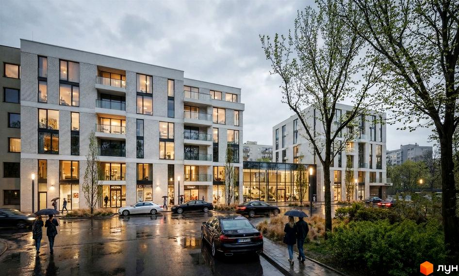 Світлі цегляні будинки Житловий комплекс на вул. Замарстинівська, 83б з великими вікнами та балконами. Прибудинкова територія з деревами та освітленням.