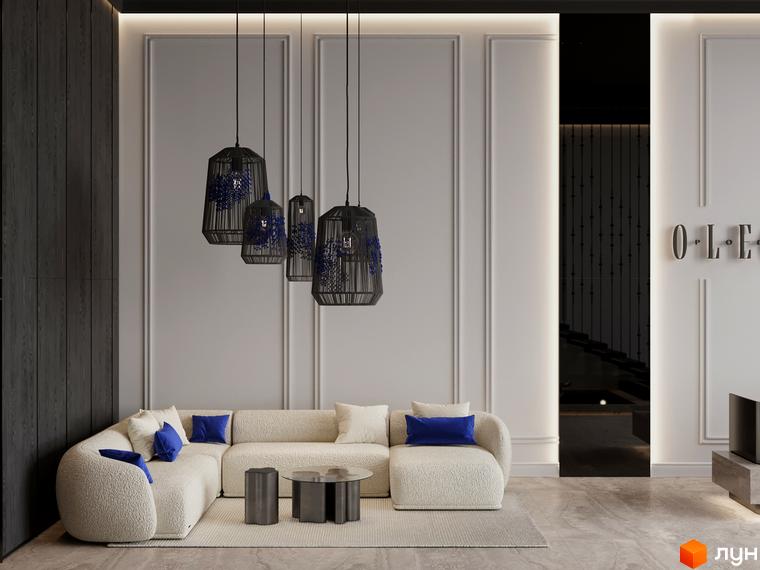 Інтер'єр вітальні в OLEGIV Boutique Residence з бежевим диваном, чорними підвісними світильниками та декоративними стіновими панелями.