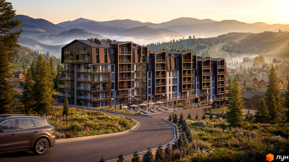 Житловий комплекс GRONO Family Residence з багаторівневим фасадом та балконами. Розташований серед гірських схилів, вкритих лісом та квітами.