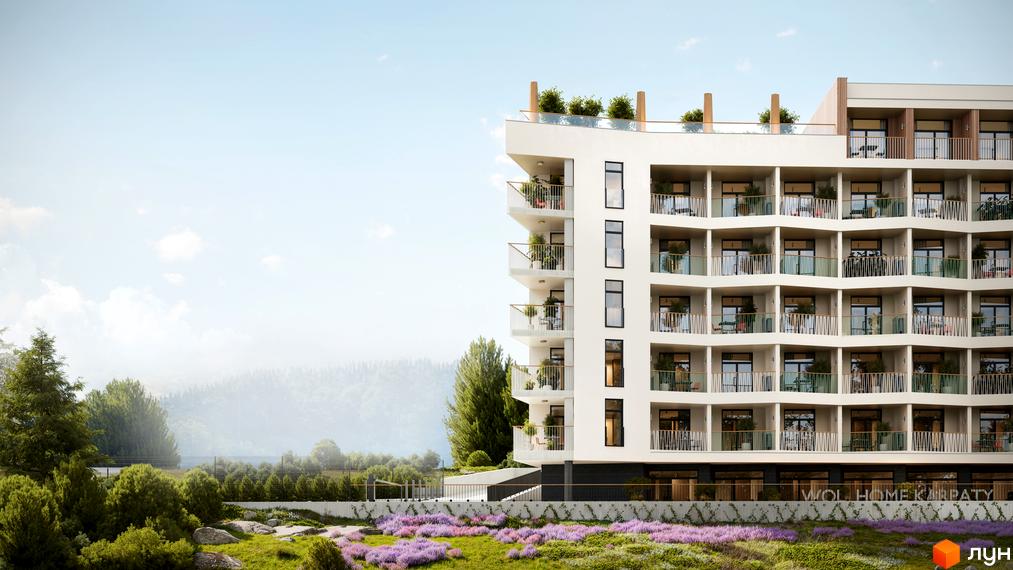 WOL. Home. Karpaty - багатоповерховий будинок з балконами та зеленими насадженнями на прибудинковій території. Новобудова розташована серед гірського ландшафту.