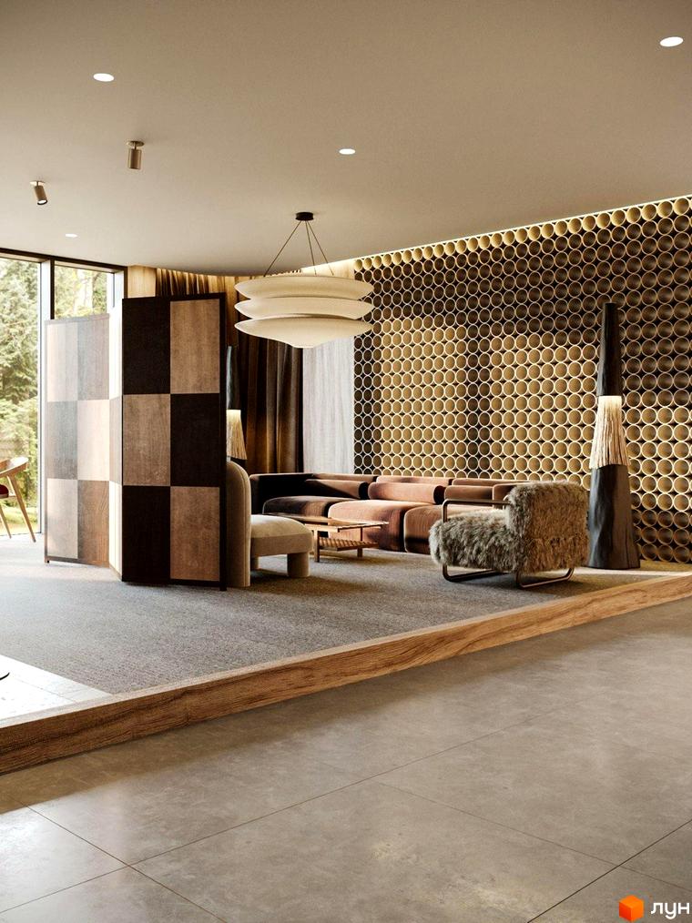 Інтер'єр вітальні в житловому комплексі Oselia apartments з диваном, кріслом та декоративною стіною. Опис новобудови для сайту.