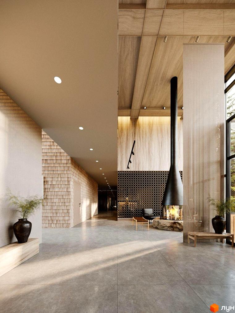 Житловий комплекс Oselia apartments: просторий хол з високими дерев'яними стелями, підвісним каміном та панорамними вікнами, що виходять на зелень.
