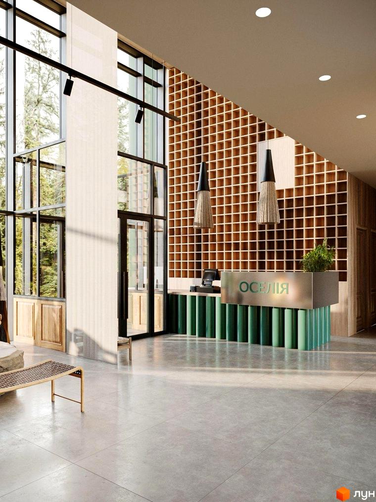 Лобі Житлового комплексу Oselia з панорамними вікнами та видом на зелену територію. Інтер'єр має дерев'яні елементи та рецепцію.
