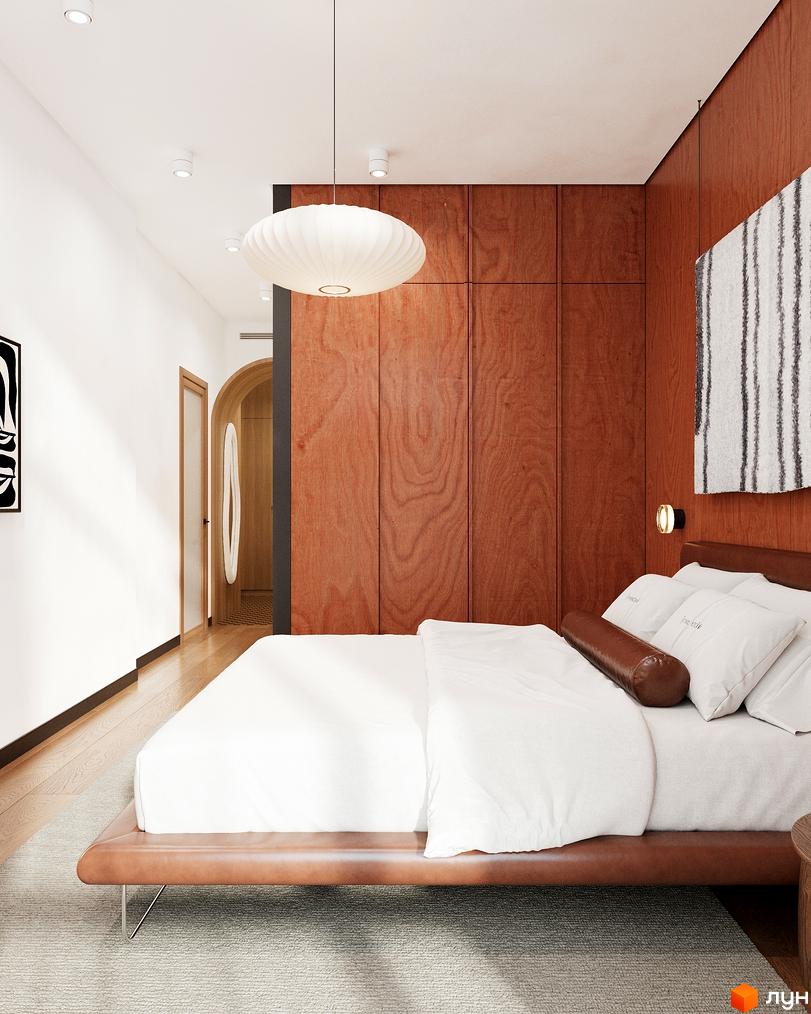 Інтер'єр спальні в Oselia Новобудова з ліжком у коричневій шкірі, дерев'яними панелями на стіні та підвісним світильником. Видно світлу підлогу та арковий прохід.