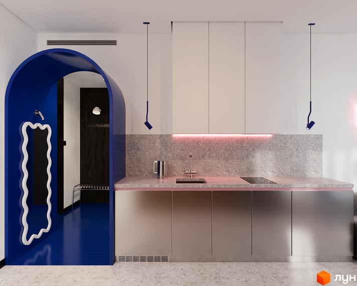 Oselia apartments: кухня з сірими фасадами та яскравою синьою аркою. Інтер'єр новобудови.