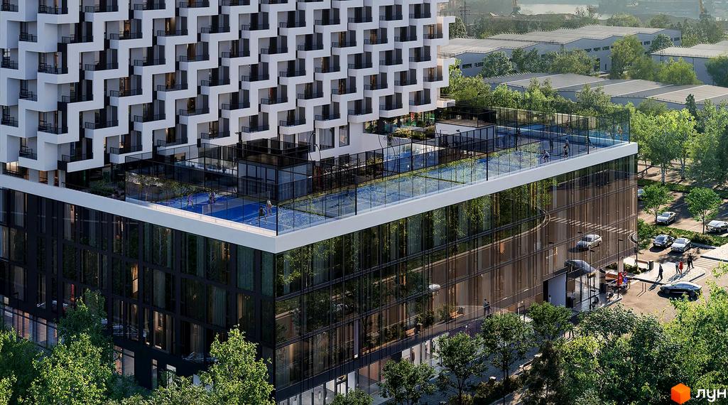 Апарт-готель Circle з білою фасадною обробкою та скляними елементами, що має відкритий басейн та спортивні майданчики на даху. Навколо будівлі розташовані дерева та паркувальні місця.