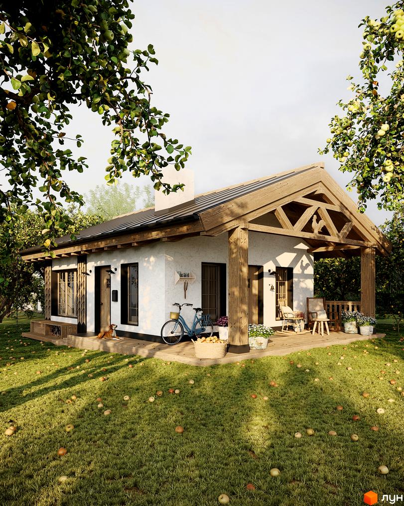 Котеджне містечко КМ ПАВЗА Village and Spa. Затишний одноповерховий будинок з дерев'яною верандою, оточений садом з яблуками.