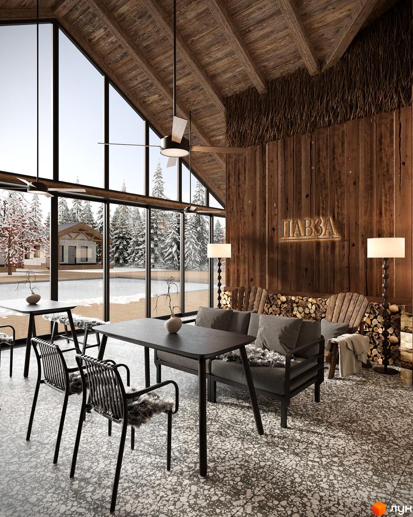 Інтер'єр комплексу КМ ПАВЗА Village and Spa з великими вікнами, що виходять на засніжений ліс та будиночки. Затишна зона відпочинку з дерев'яними елементами та каміном.