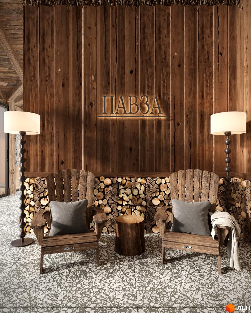 Котеджне містечко ПАВЗА Village and Spa: затишна зона відпочинку з дерев'яними кріслами та каміном. Настінний декор з логотипом проєкту.