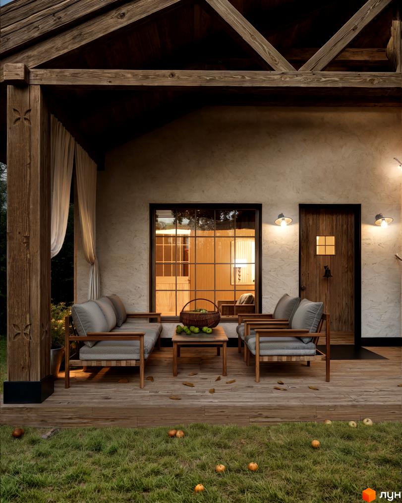 Котеджне містечко КМ ПАВЗА Village and Spa: затишна тераса з дерев'яними меблями та кошиком яблук, фасад будинку з вікнами та дверима, зелена галявина з яблуками.