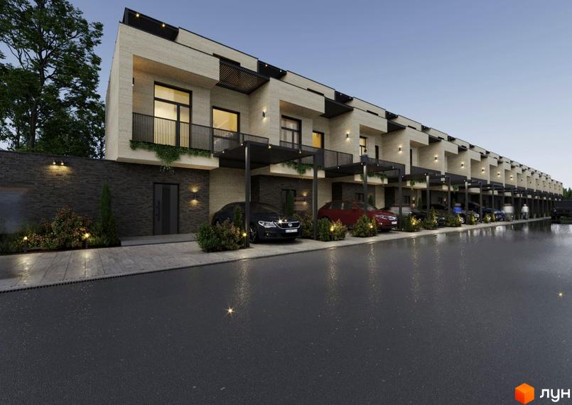 Новобудова на вулиці Волошкова з сучасними фасадами та доглянутою прибудинковою територією, де розташовані автомобілі.