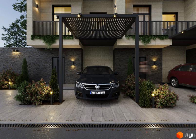 Зовнішній вигляд будинку з темним фасадом та навісом для авто. Прибудинкова територія з освітленням та кущами.