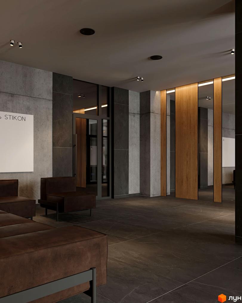 Лобі Житлового комплексу Real Park Nova з темною підлогою, стінами з бетону та дерева, і коричневими диванами.