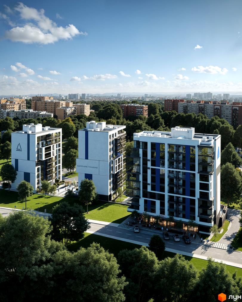 Новобудова Sapphire Towers з біло-синіми фасадами та скляними балконами, оточена зеленим ландшафтом та міським пейзажем.