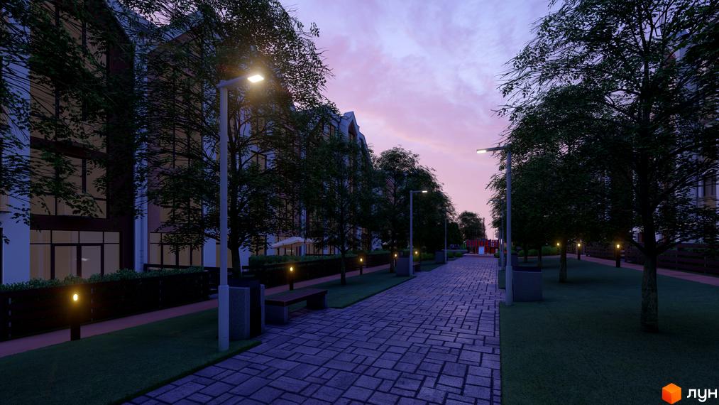 Житловий комплекс Smart Residence з будівлями з великими вікнами. Вечірній вид на бруковану алею з деревами, ліхтарями та дитячим майданчиком.