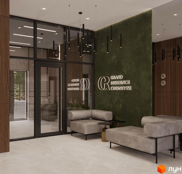 Вхідна група новобудови Grand Residence Chernivtsi з диванами для відпочинку та логотипом комплексу. Сучасний дизайн лобі житлового комплексу.