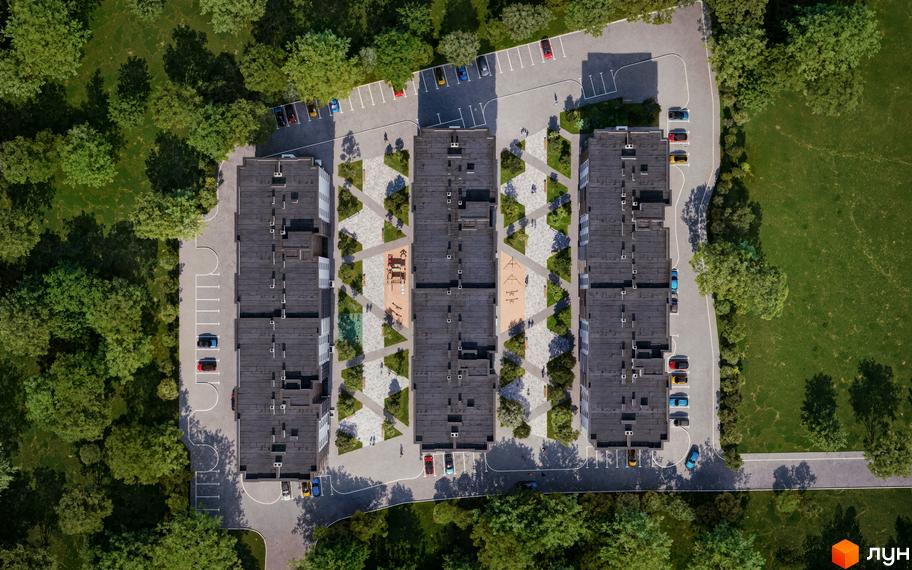 Аерофотознімок трьох багатоповерхових будівель Житлового комплексу GREENHOUSE KALYNIV з темними дахами. Прибудинкова територія має парковки, зелені зони та дитячі майданчики.