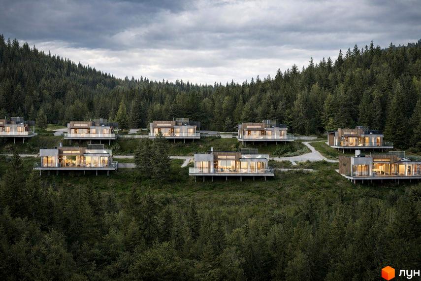 Котеджне містечко КМ MÓNTES invest & resort: сучасні будинки на схилі гори серед лісу. Територія комплексу оточена деревами.