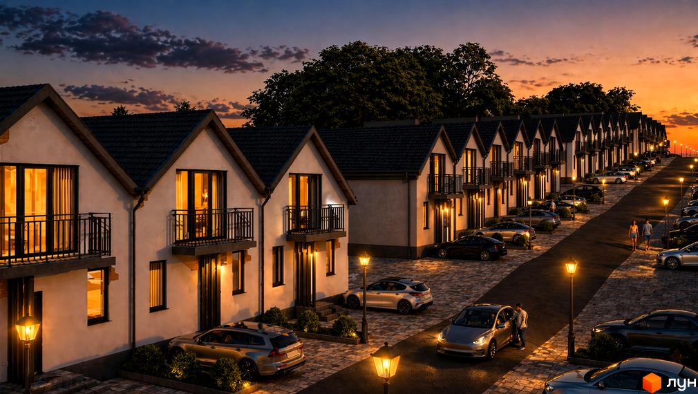 Таунхауси Lisnyky House з балконами та вікнами, що світяться, на тлі вечірнього неба. Прибудинкова територія з освітленими ліхтарями вулицями та припаркованими автомобілями.